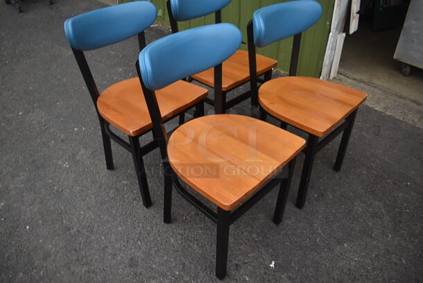 4 Chairs With Black Frame, Wood Style Seat And Blue Cushioned Stretcher. 4 Times Your Bid! Cosmetic Condition May Vary. - Image 2 of 3