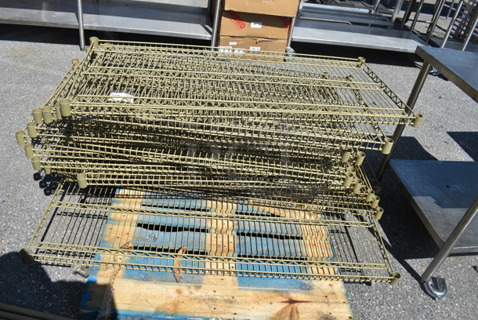 Disassembled Metro Style Shelving Unit With Legs, Gold Color.