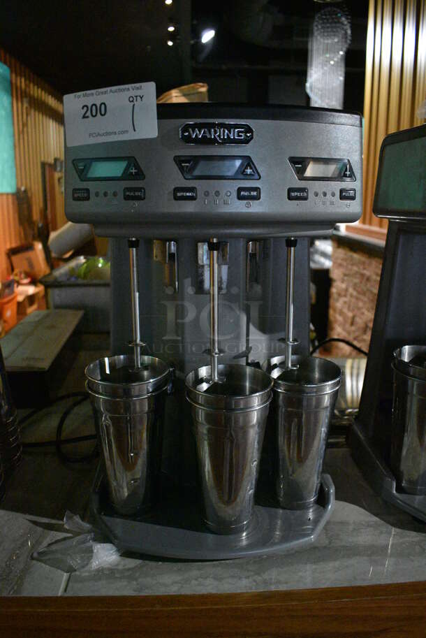 Waring WDM360TX Metal Commercial Countertop 3 Head Drink Mixer w/ 6 Metal Mixing Cups. 120 Volts, 1 Phase. 13x10.5x20. Item Was in Working Condition on Last Day of Business. (bar)
