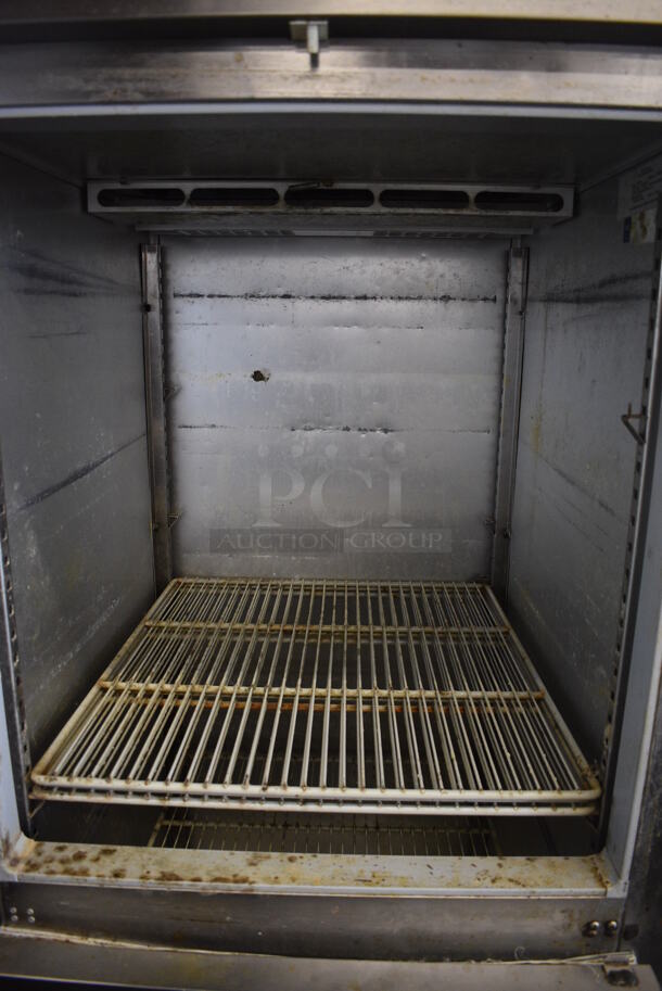 Delfield Model MFR1-SH Stainless Steel Commercial 2 Half Size Door Reach In Freezer w/ Poly Coated Racks on Commercial Casters. 115 Volts, 1 Phase. 29x34x79. Tested and Powers On But Temps at 45 Degrees - Image 5 of 6