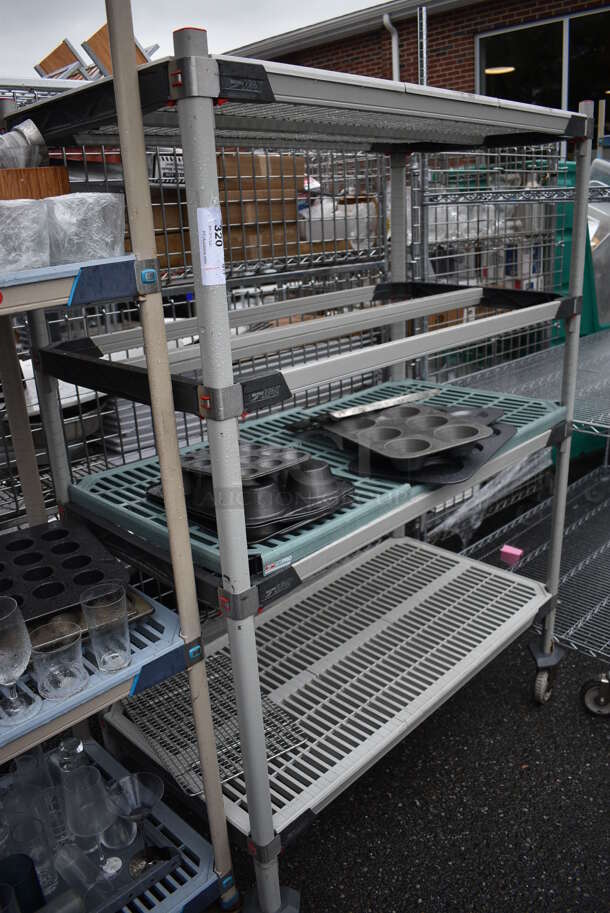 ALL ONE MONEY! Lot of Poly Finish 4 Tier Shelving Unit on Commercial Casters w/ All Contents Including Metal Muffin Baking Pans. BUYER MUST DISMANTLE. PCI CANNOT DISMANTLE FOR SHIPPING. PLEASE CONSIDER FREIGHT CHARGES. 48x24x68
