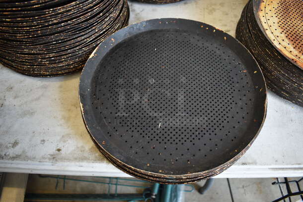 12 Metal Round Perforated Pizza Baking Pans. 13x13x1. 12 Times Your Bid!