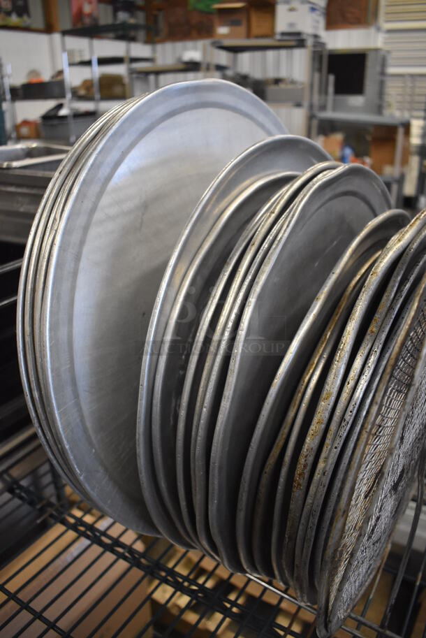 ALL ONE MONEY! Lot of Metal Pizza Pan Rack w/ 2 Metal Pizza Screens and 20 Metal Round Pizza Baking Pans. Rack: 14x9x9.5 - Image 5 of 6