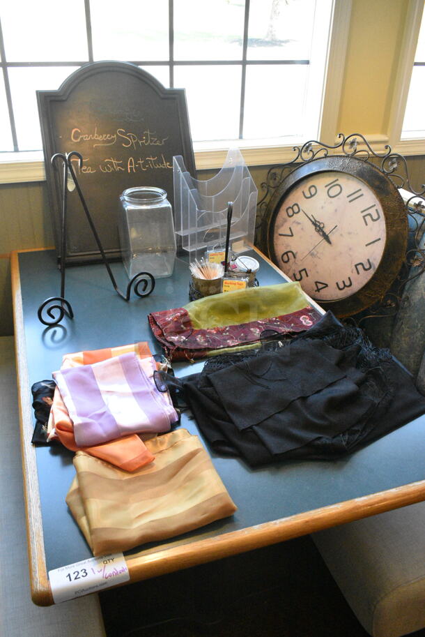 Wall Mount Table w/ Contents Including Clock and Decor. BUYER MUST REMOVE: Bring Tools and Manpower Needed To Remove This Item. (booth room)  - Image 3 of 9
