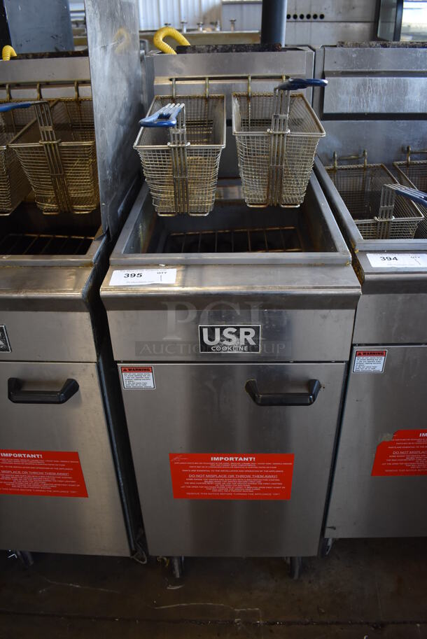 2019 USR Cookline CF-40 Stainless Steel Commercial Floor Style Natural Gas Powered Deep Fat Fryer w/ 2 Metal Fry Baskets on Commercial Casters. 90,000 BTU. 16x30x45