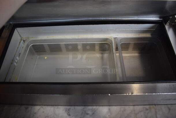 2014 Model Leader ESPT72SC Commercial Stainless Steel Electric Powered Pizza Prep Table With Enclosed Top For Plastic Ingredient Pans, Marble Style Prep Counter With Polycoated Racks on Commercial Casters. 115V Tested And Powers On But Does Not Get Cold - Image 4 of 9