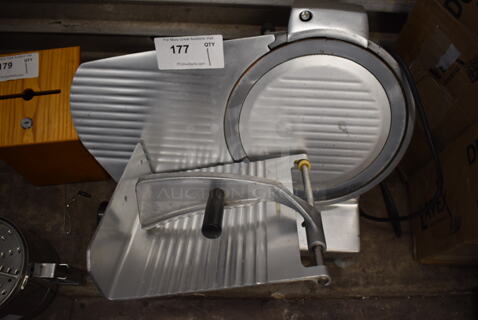 2010 Omcan HBS-300 Stainless Steel Commercial Countertop Meat Slicer w/ Blade Sharpener. 120 Volts, 1 Phase. 23x19x17. Tested and Does Not Power On