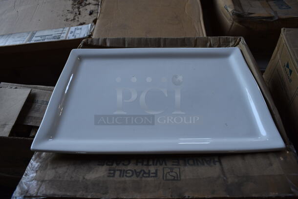 12 BRAND NEW IN BOX! Tuxton BWH-1544 White Ceramic Rectangular Plates. 16x11x1. 12 Times Your Bid!