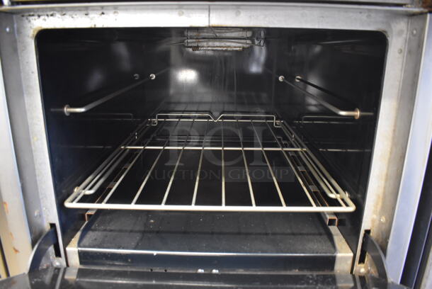 Southbend S24E Stainless Steel Commercial Natural Gas Powered 4 Burner Range w/ Oven and Back Splash on Commercial Casters. 24.5x34x47 - Image 5 of 6