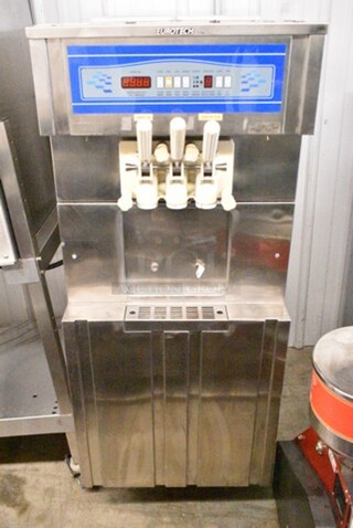 Eurotech OP138CS Stainless Steel Commercial Floor Style Air Cooled 2 Flavor w/ Twist Soft Serve Ice Cream Machine on Commercial Casters. 220 Volts, 1 Phase.