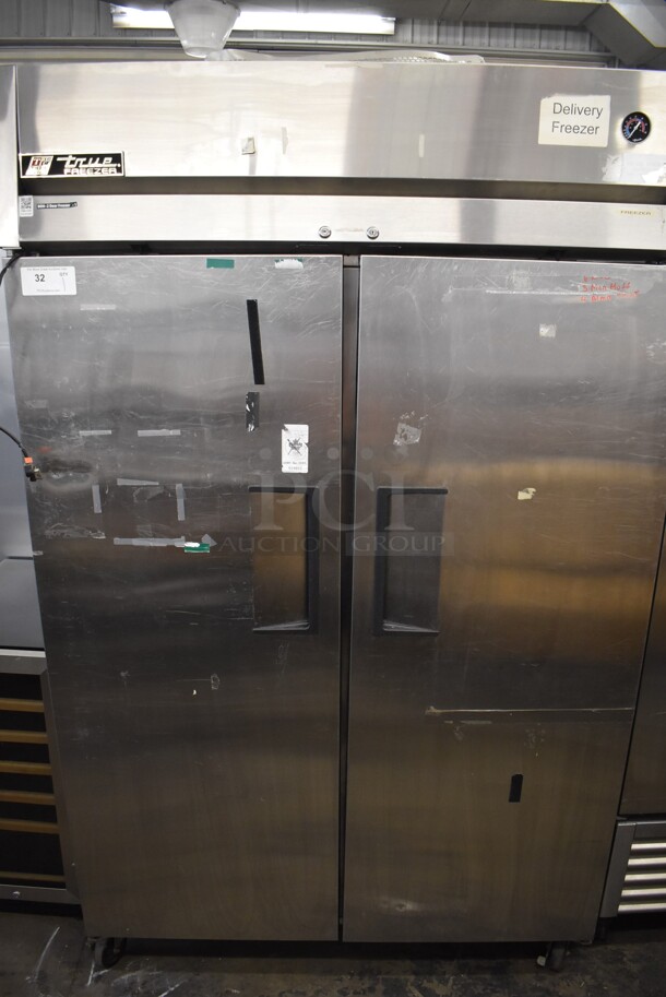 2011 True TG2F-2S Stainless Steel Commercial 2 Door Reach In Freezer w/ Poly Coated Racks on Commercial Casters. 115 Volts, 1 Phase. 51x35x83. Tested and Does Not Power On