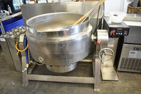 GLRQ-2 Stainless Steel Commercial Natural Gas Powered Floor Style Tilting Kettle Steam Kettle. Kettle Is Electric and Gas Powered. Kettle Is 32x32x20. 200 Volts.