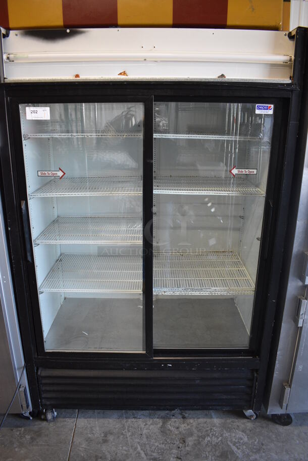 True Model GDM-45 Metal Commercial 2 Door Cooler Merchandiser w/ Sliding Doors and Poly Coated Racks on Commercial Casters. 115 Volts, 1 Phase. 51.5x31x82.5. Tested and Working! - Image 1 of 6