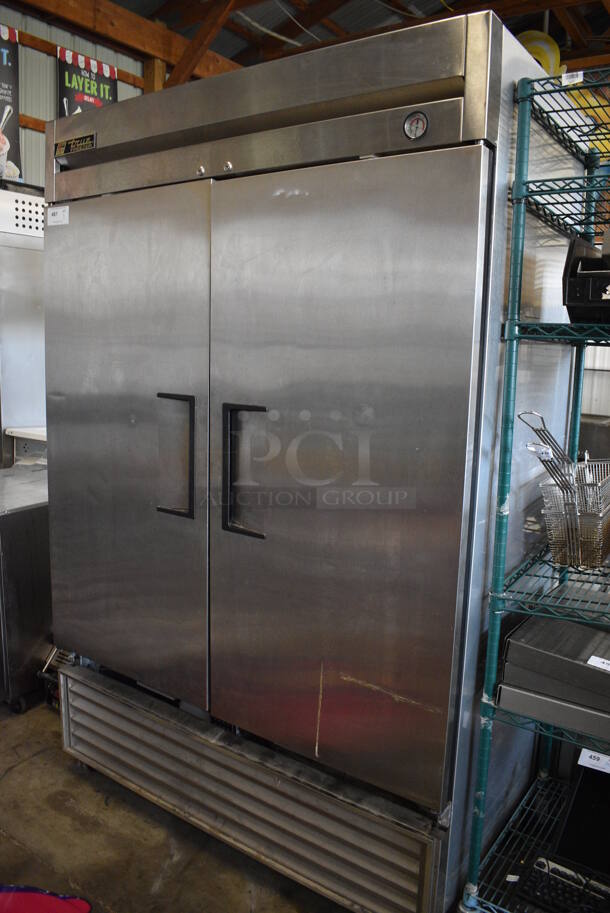 True Model T-49F Stainless Steel Commercial 2 Door Reach In Freezer w/ Poly Racks on Commercial Casters. 115 Volts, 1 Phase. 54x30x83. Tested and Working!