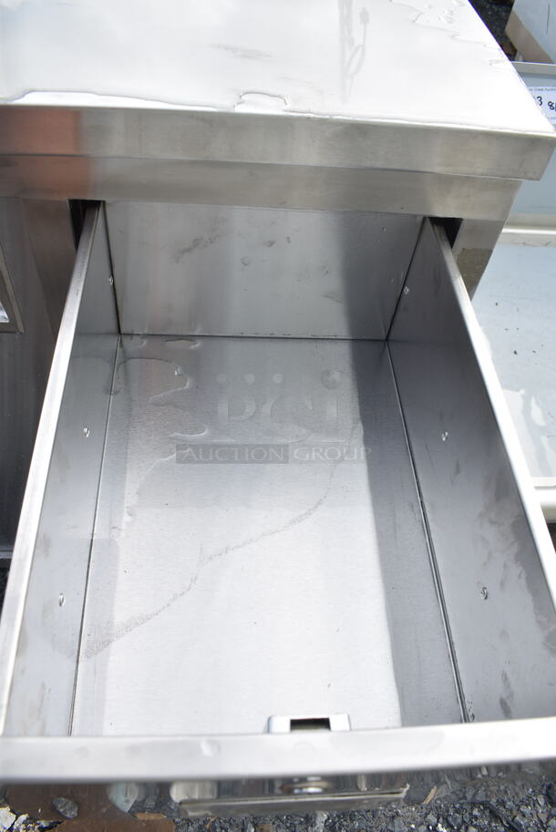 BRAND NEW SCRATCH AND DENT! Regency 600EBT2472R 24" x 72" 16 Gauge Type 304 Stainless Steel Enclosed Base Sliding Door Table with Drawers - Image 3 of 6