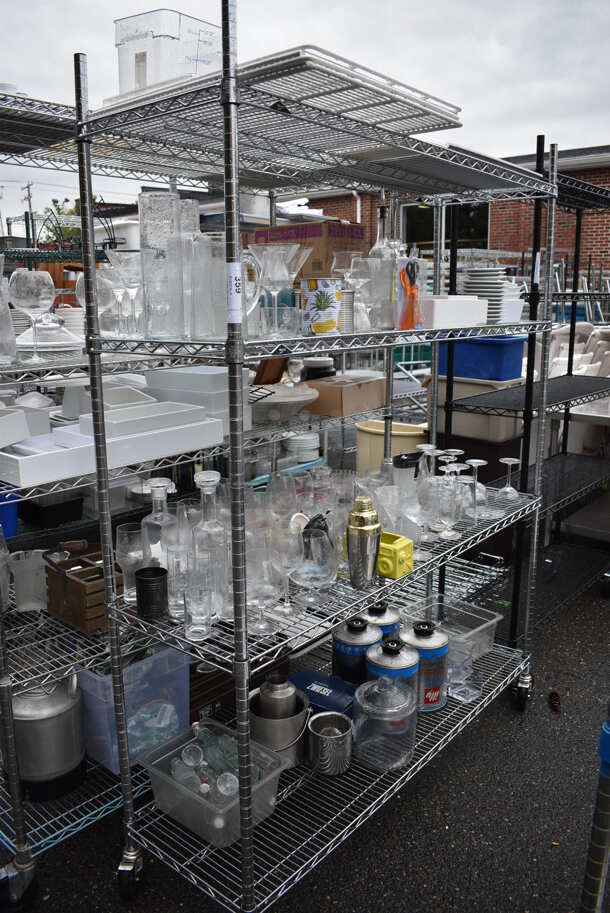 ALL ONE MONEY! Lot of Chrome Finish 4 Tier Shelving Unit on Commercial Casters w/ All Contents Including Glassware, Ceramic Plates, Metal Ice Bucket. DISMANTLE FOR SHIPPING. PLEASE CONSIDER FREIGHT CHARGES. 60x18x79