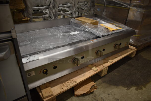 BRAND NEW SCRATCH AND DENT! Cooking Performance Group 351GMCPG48NL Stainless Steel Commercial Countertop Natural or Propane Gas Powered Flat Top Griddle w/ Thermostatic Controls. 