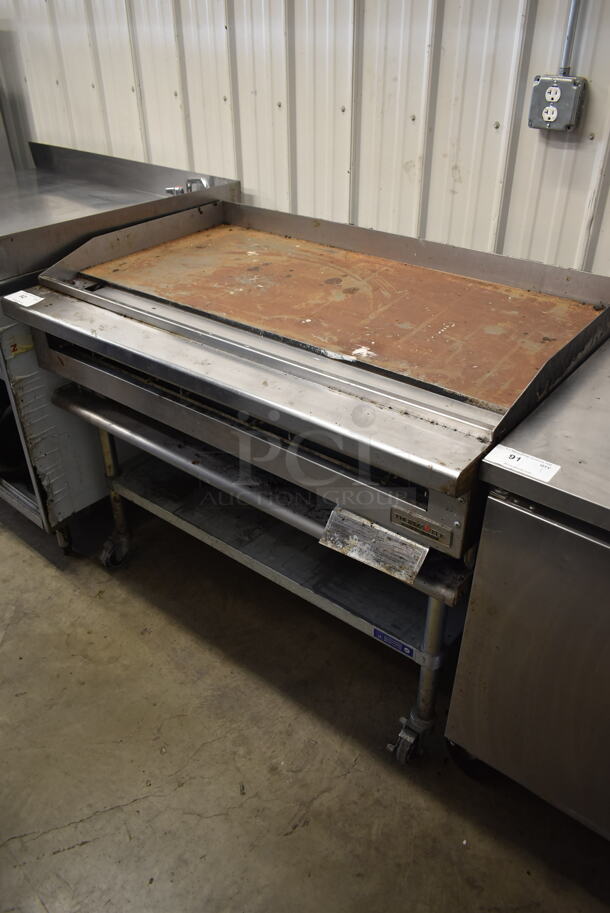 Thermatek TC48-48GN Stainless Steel Commercial Natural Gas Powered Flat Top Griddle on Stainless Steel Equipment Stand w/ Commercial Casters. - Image 1 of 6
