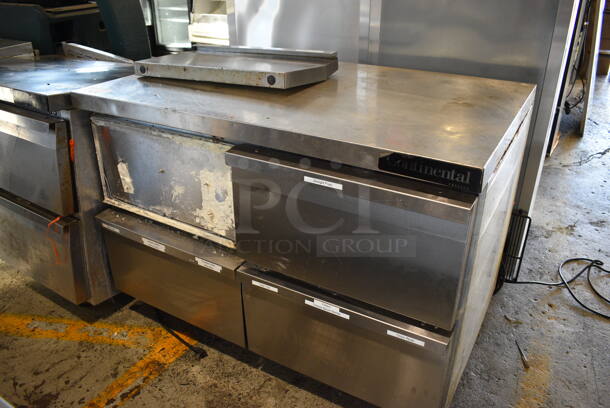 Continental Model SWF48 Stainless Steel Commercial Undercounter 4 Drawer Freezer on Commercial Casters. 1 Drawer Needs Front Reattached. 115 Volts, 1 Phase. 48x30x34. Tested and Powers On But Temps at 56 Degrees