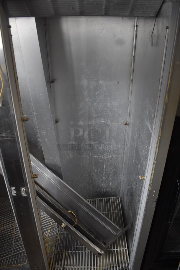 Beverage-Air ER48-1AS Commercial Stainless Steel Two-Section Solid Door Reach-In Cooler With Racks on Commercial Casters. Doors Need Reattached. 115V/1 Phase Tested And Powers On But Does Not Get Cold - Image 4 of 5