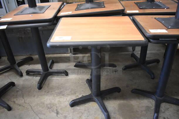 Wood Pattern Dining Height Table on Black Metal Table Base. Stock Picture - Cosmetic Condition May Vary. 24x20x30