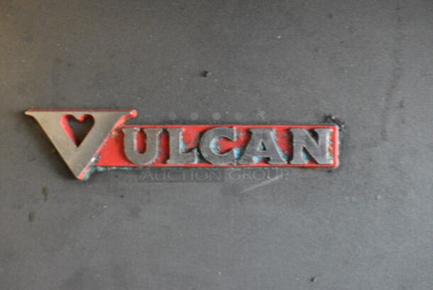 Vulcan E60 Stainless Steel Commercial Electric Powered 10 Burner Hot Plate Range w/ 2 Ovens, Over Shelf and Back Splash. 240 Volts, 1 Phase.  - Image 2 of 8