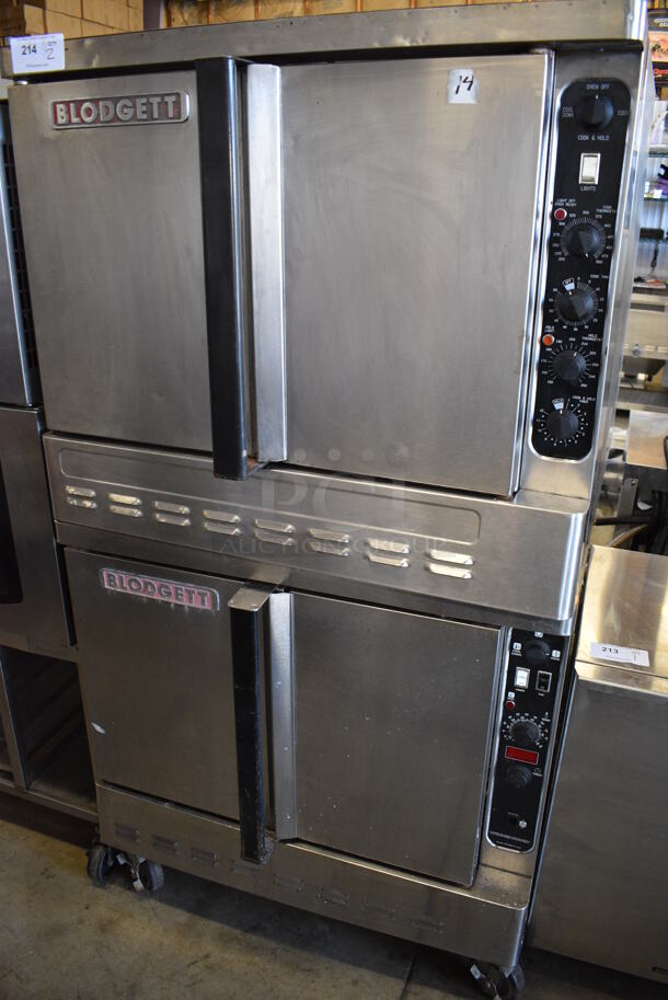 2 Blodgett Stainless Steel Commercial Natural Gas Powered Full Size Convection Ovens w/ Solid Doors, Metal Oven Racks and Thermostatic Controls on Commercial Casters. Comes w/ Legs. 38x37x71. 2 Times Your Bid!
