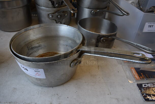2 Various Metal Sauce Pots. Includes 17.5x10x5.5. 2 Times Your Bid!