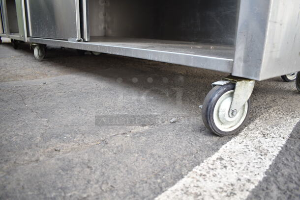 WinHolt Stainless Steel Counter w/ Back Splash, Under Shelf and Doors on Commercial Casters.  - Image 2 of 5