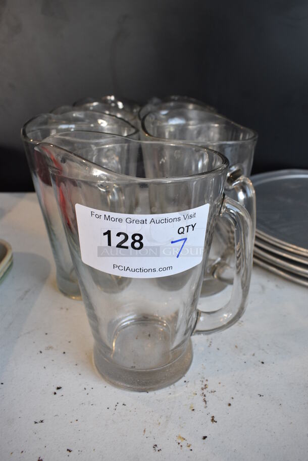 7 Glass Pitchers. 7x5.5x9. 7 Times Your Bid! - Image 1 of 3