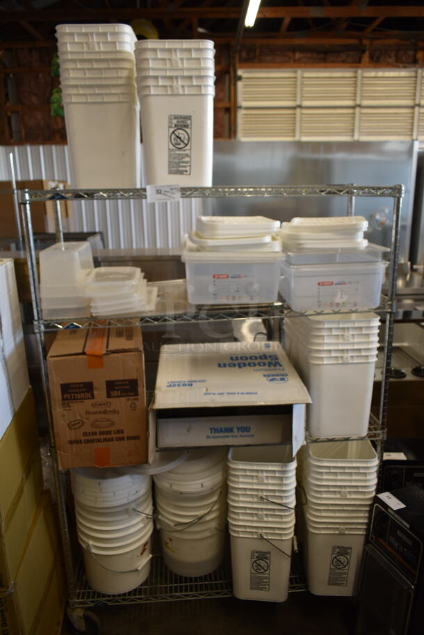 ALL ONE MONEY! Lot of Various Items on Shelving Unit Including Poly Bins and Lids. Does Not Include Shelving Unit.