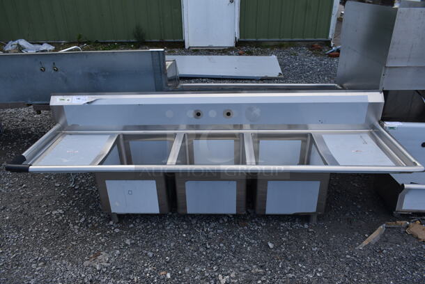 BRAND NEW SCRATCH AND DENT! Regency 600S31620218 Stainless Steel Commercial 3 Bay Sink w/ Dual Drain Boards. No Legs. Bays 16x20. Drain Boards 16x22 - Image 1 of 4