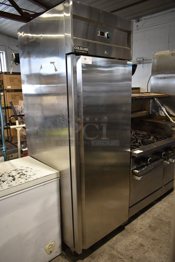 Coldline M28F Stainless Steel Commercial Single Door Reach In Freezer w/ Poly Coated Racks on Commercial Casters. 115 Volts, 1 Phase. Tested and Powers On But Does Not Get Cold - Image 1 of 6