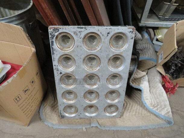 One Aluminum Commercial 15 Hole Muffin Pan.