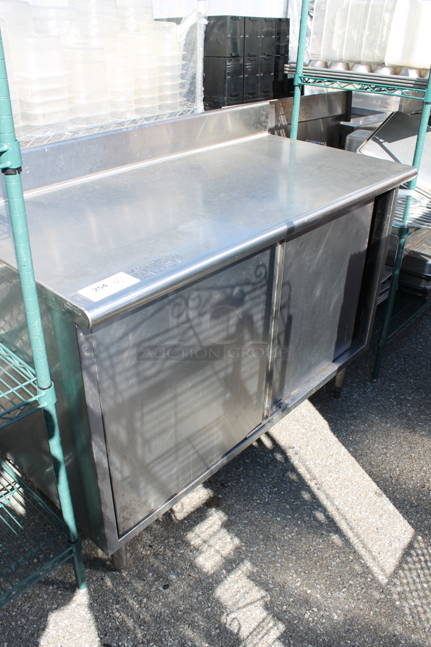 Stainless Steel Table w/ Back Splash and 2 Doors.