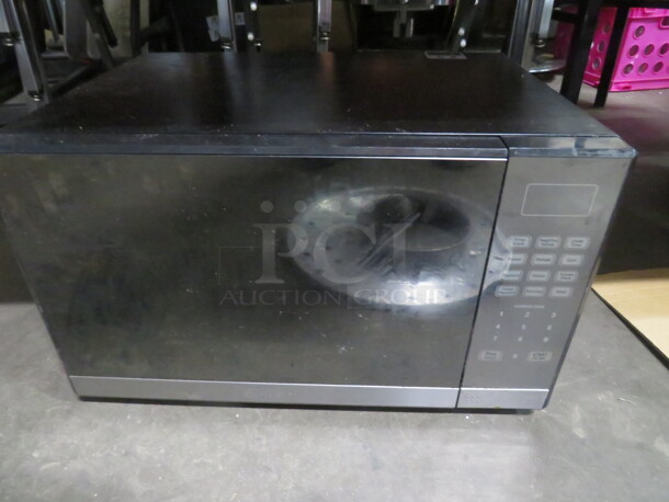 One Oster Microwave. Model# EG034AL7X1. 120 Volt. 20X16X12 - Image 1 of 2