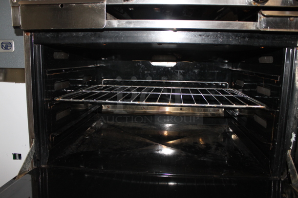 Dynamic Cooking Systems DCS 60-24G6-2N Stainless Steel Commercial Natural Gas Powered 6 Burner Range w/ Left Side Flat Top Griddle, 2 Ovens, Over Shelf and Back Splash on Commercial Casters. - Image 7 of 11