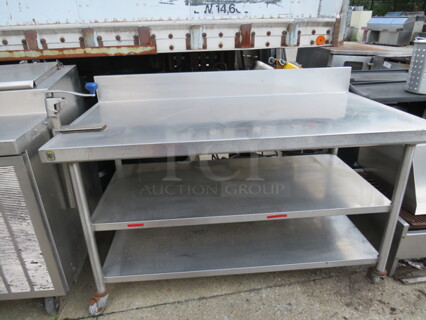 One Stainless Steel Table With 2 Stainless Steel Under Shelves, Back Splash, And 10lb Can Opener, On Casters. 60X32X39