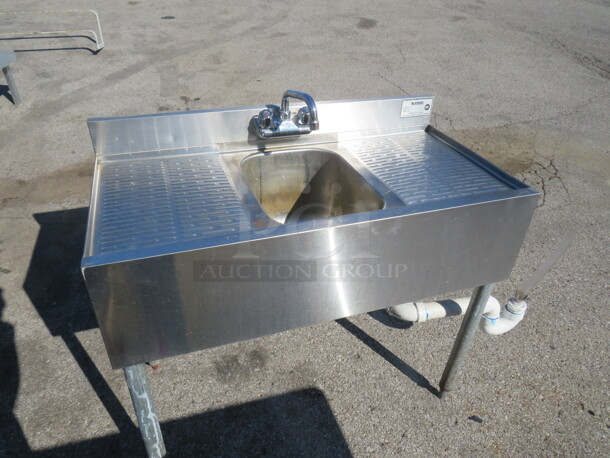 One Krowne Stainless Steel Under Bar Sink With Faucet, Back Splash And R/L Drain Boards. 36X20X32 - Image 1 of 2