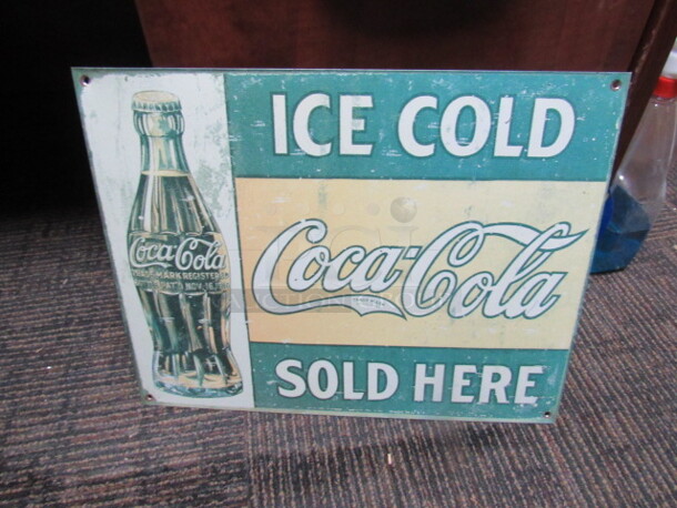 One 16X12 Coca Cola Tin Sign.