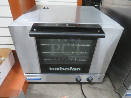 One Moffat Turbo Fan Half Size Convection Oven, With 3 Racks. Model# E22M3. 115 Volt.  24X26X21.