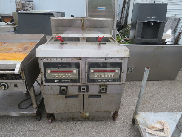 One Henny Penny Natural Gas Double Deep Fryer With 2 Baskets On Casters. Unable To Test. Model# OFG-322. 33.5X33.5X46.5 - Image 1 of 1