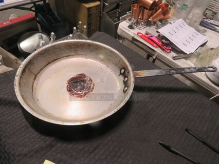 One 14.5 Inch Superior Fry Pan. 