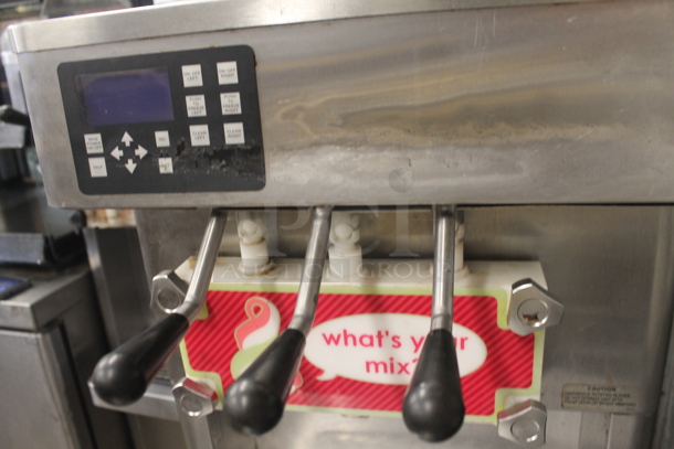 2014 Stoelting F231-18I2-OT2 Stainless Steel Commercial Floor Style Water Cooled 2 Flavor w/ Twist Soft Serve Ice Cream Machine on Commercial Casters. 208-240 Volts, 1 Phase.  - Image 4 of 6