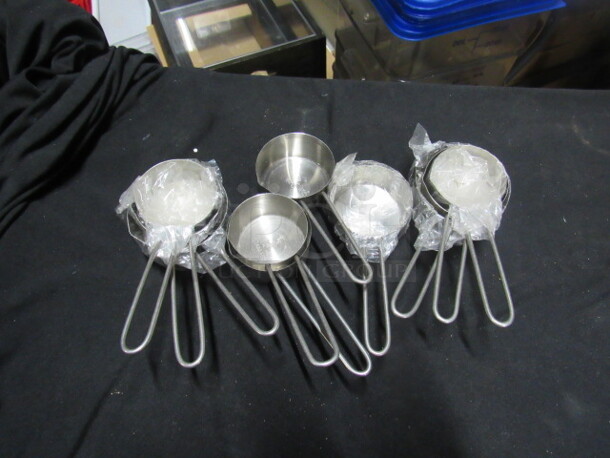 One Mega Lot Of Assorted NEW SS Measuring Cups.