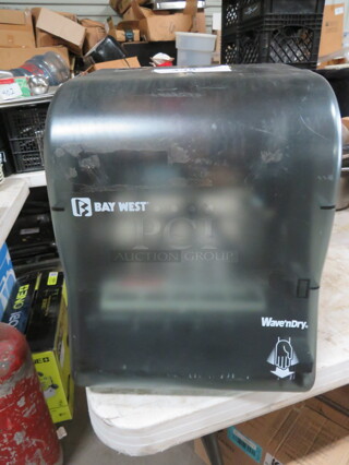One Bay West Paper Towel Dispenser. 