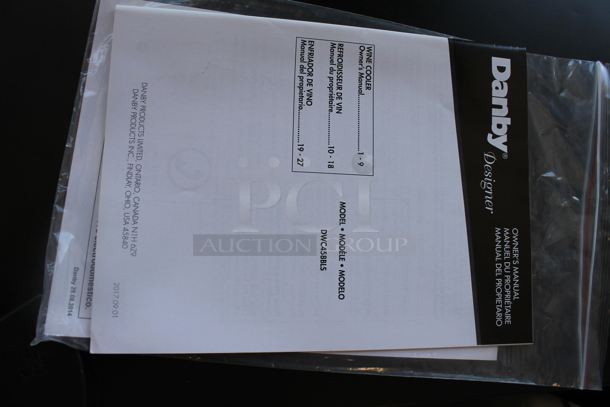 BRAND NEW SCRATCH AND DENT! Danby DWC458BLS Designer Series Metal Wine Cooler / Wine Cellar Merchandiser with 45 Bottle Capacity, 7 Slide-Out Wooden Racks, Blue LED Lighting and Tempered Glass Door. 115 Volts, 1 Phase. Tested and Working!
 - Image 3 of 5