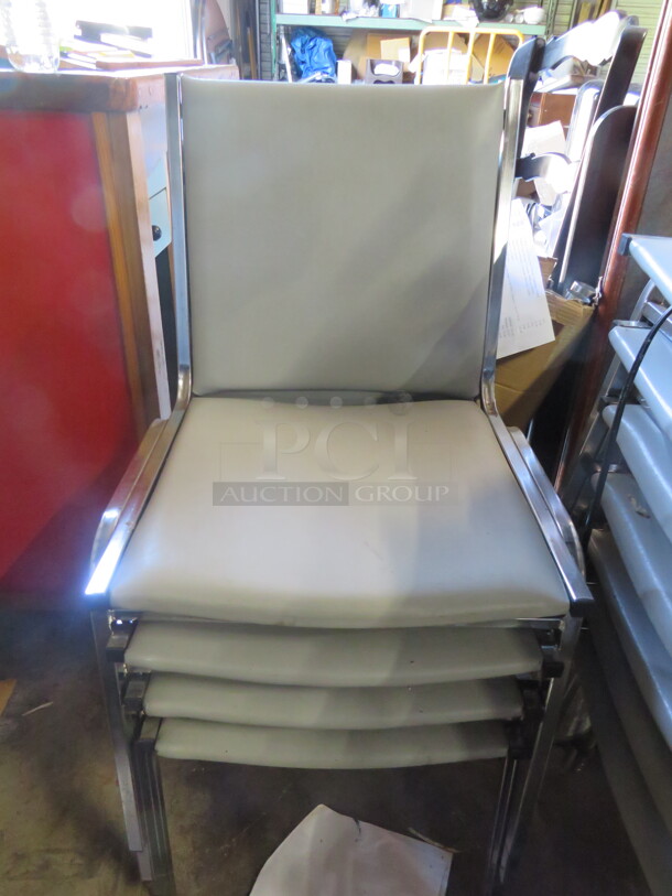 Chrome Metal Stack Chair With Grey Cushioned Seat And Back. 3XBID