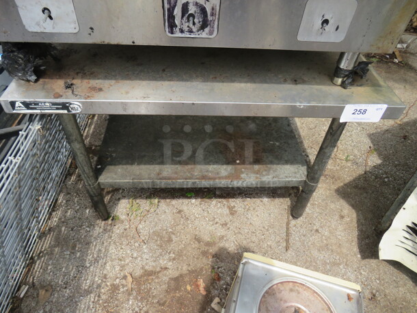 One Stainless Steel Equipment Table With Under Shelf. 36X24X24