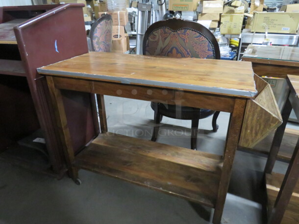 One Wooden Table With Undershelf, And Wooden Side Holder On Casters. 48X21X34.5